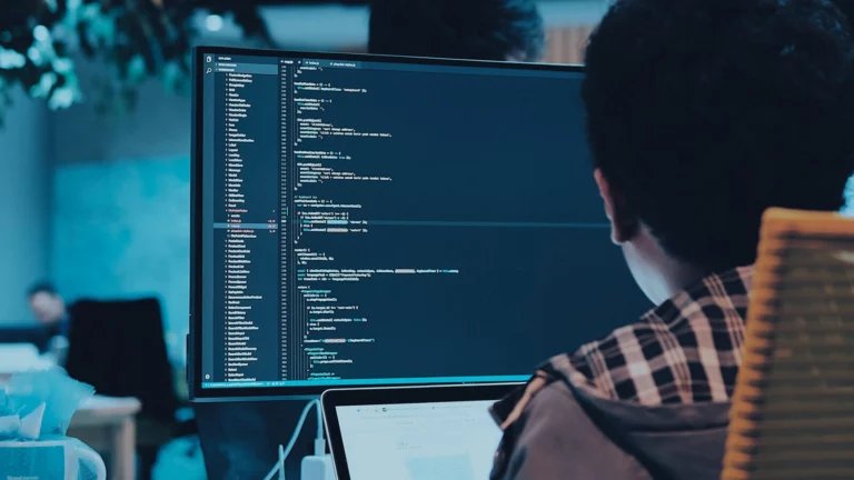 man-coding-on-computer-screen